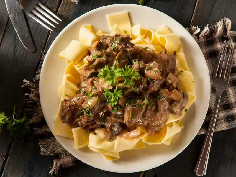 Beef Stroganoff in plate with fork 