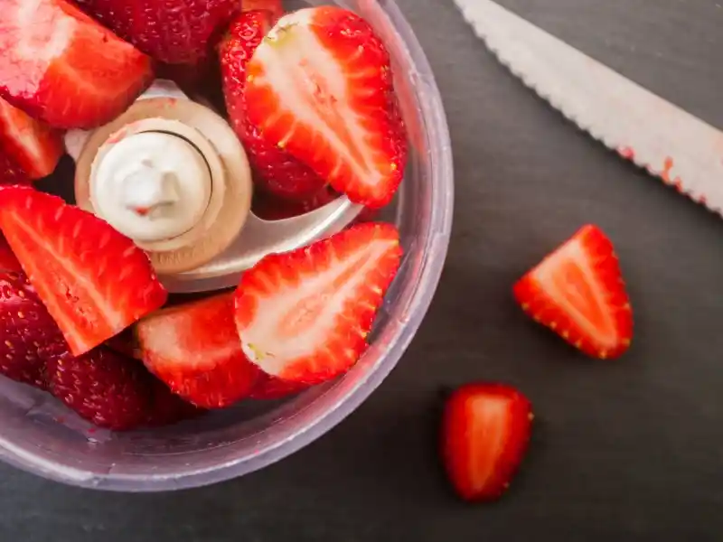 Chopped strawberries in food processor 