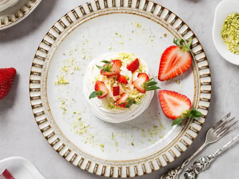 Strawberry pavlova with strawberry frosting in plate 