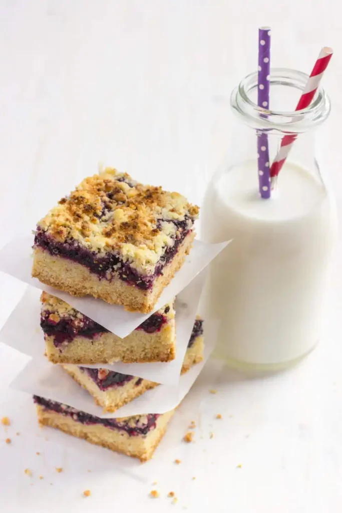  blueberry crumb bars with glass of milk