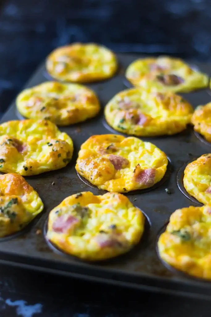 Colorful breakfast egg muffins with vegetables and cheese