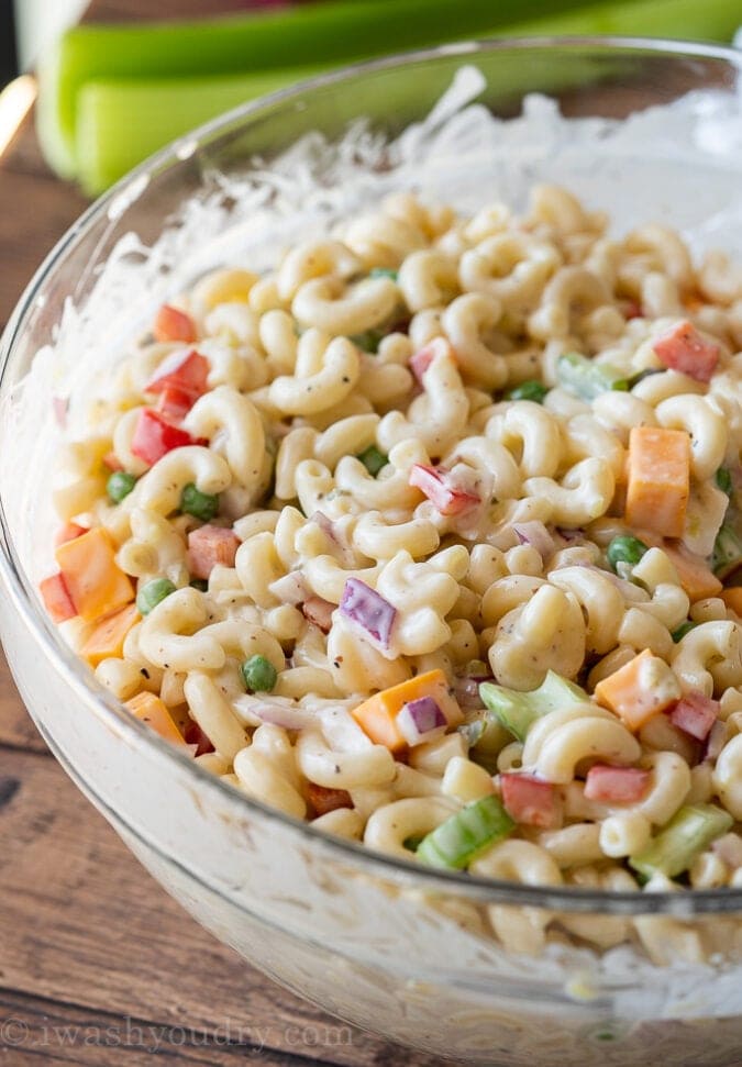 A bowl of Macaroni Salad with elbow macaroni, diced vegetables, and creamy dressing