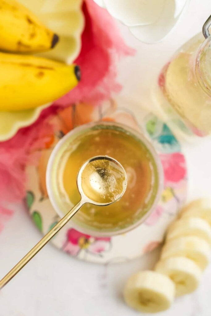 tasting banana syrup with spoon