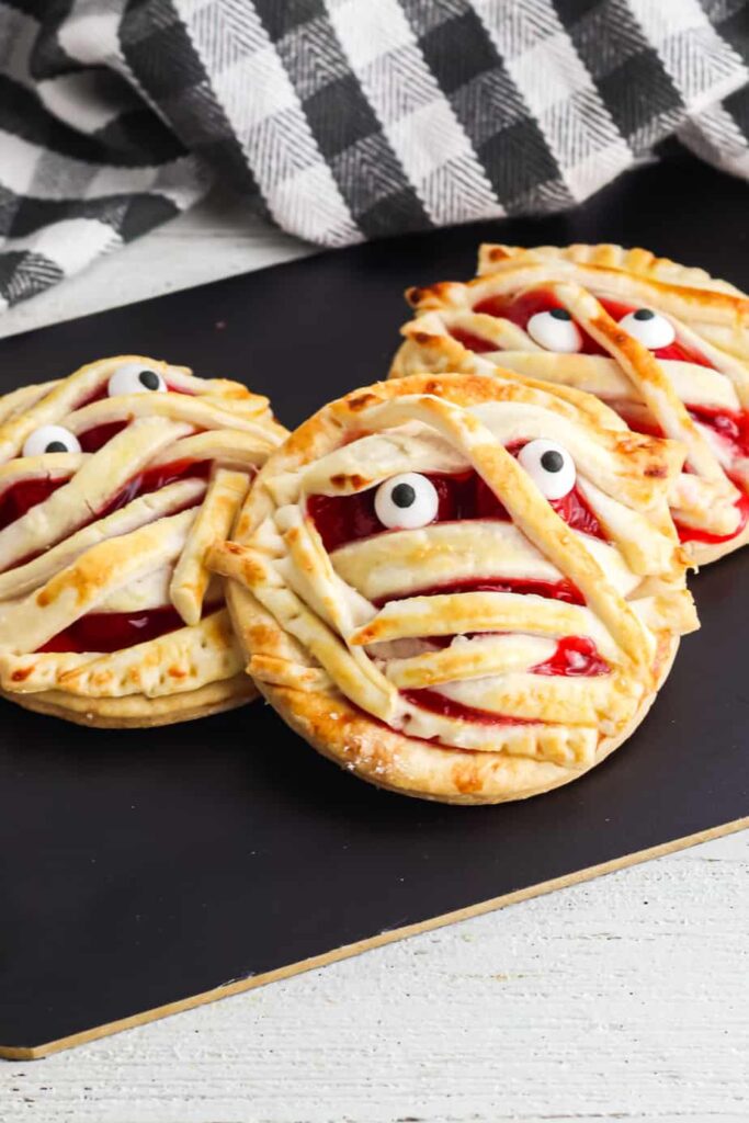 Mummy Halloween Cherry Hand Pies decorated with mummies