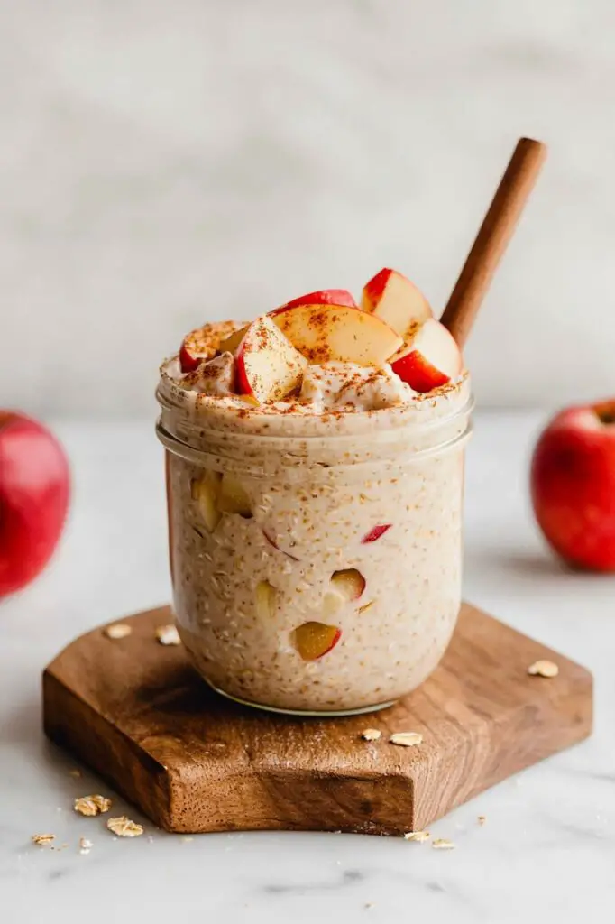Apple Pie Overnight Oats in glass place in wooden board