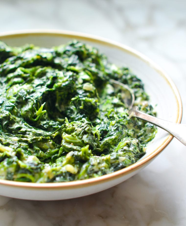 Creamed Spinach in plate with spoon