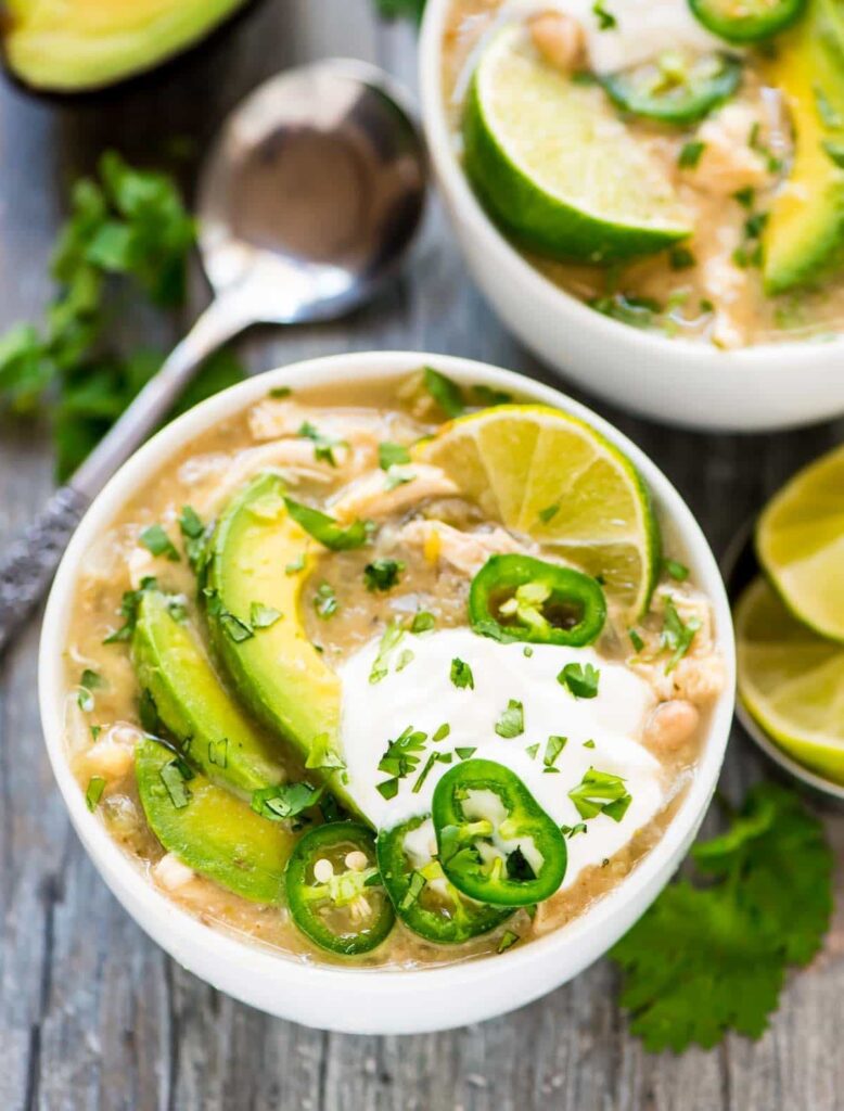 Crockpot White Chicken Chili in bowl with spoon