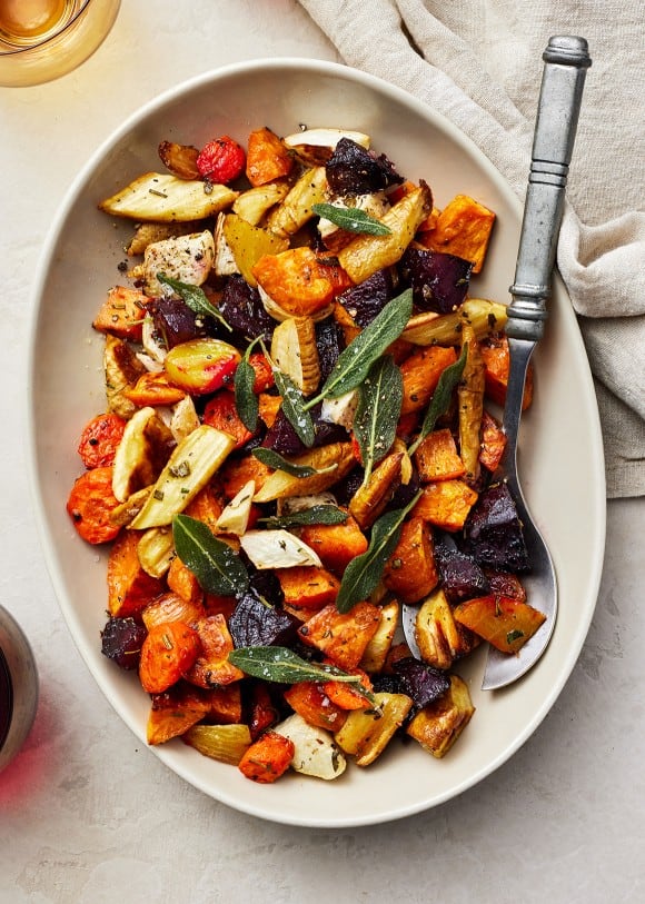 Roasted Root Vegetables in dish with steel spoon