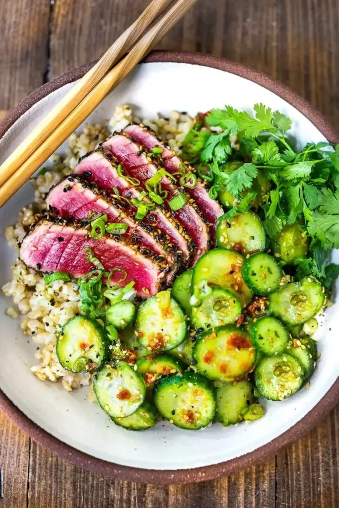 Seared Ahi Tuna in plate with wooden spoon