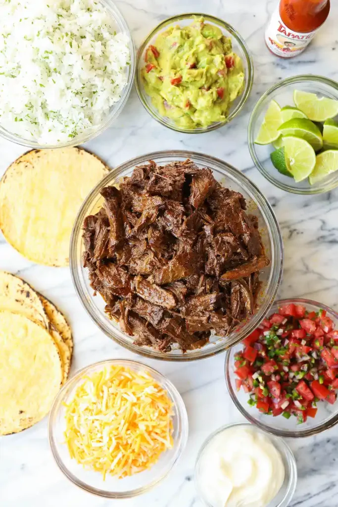 Slow Cooker Beef Barbacoa in glass bowl