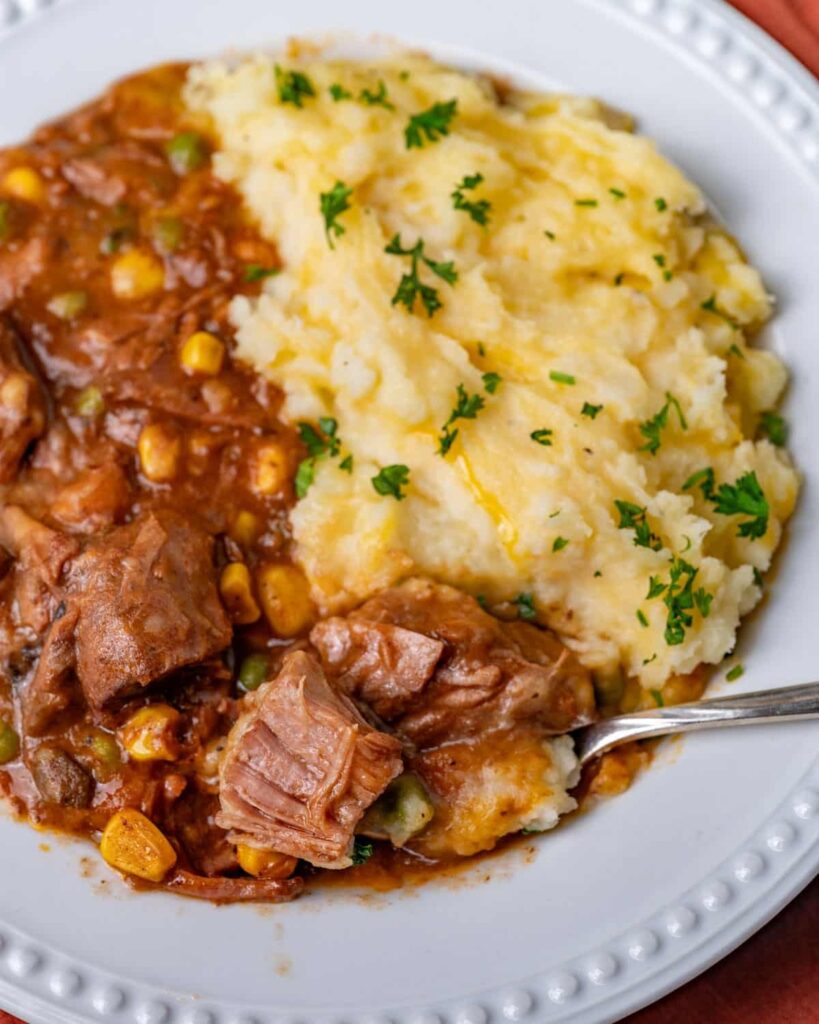 Slow Cooker Shepherd’s Pie in plate with spoon