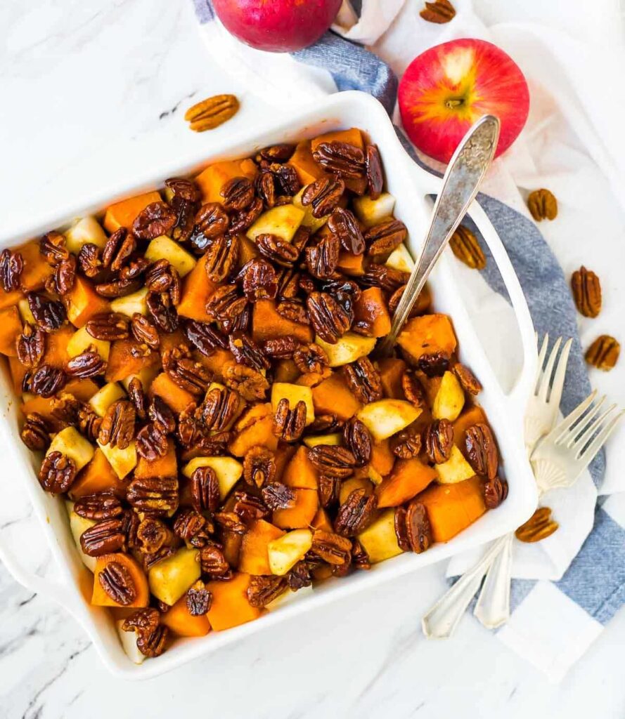 Glazed Sweet Potatoes with Pecans in white square dish