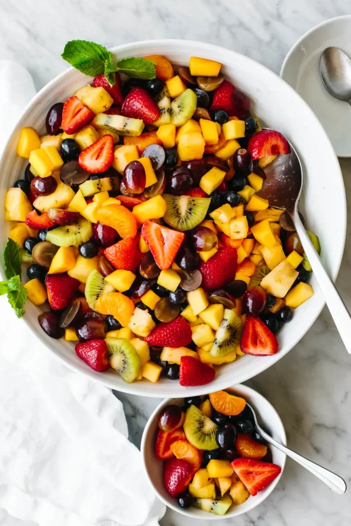 Fruit salad in one plate and in one small bowl 