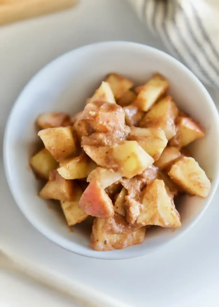 Stewed Almond Butter Apples in white bowl 