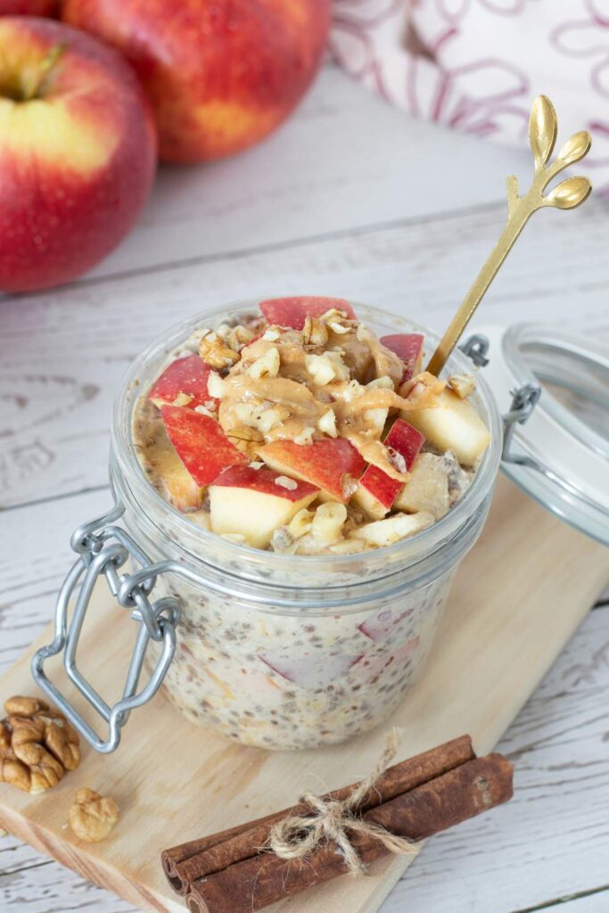  Apple Cinnamon Overnight Oats With Almond Milk in glass with wooden spoon