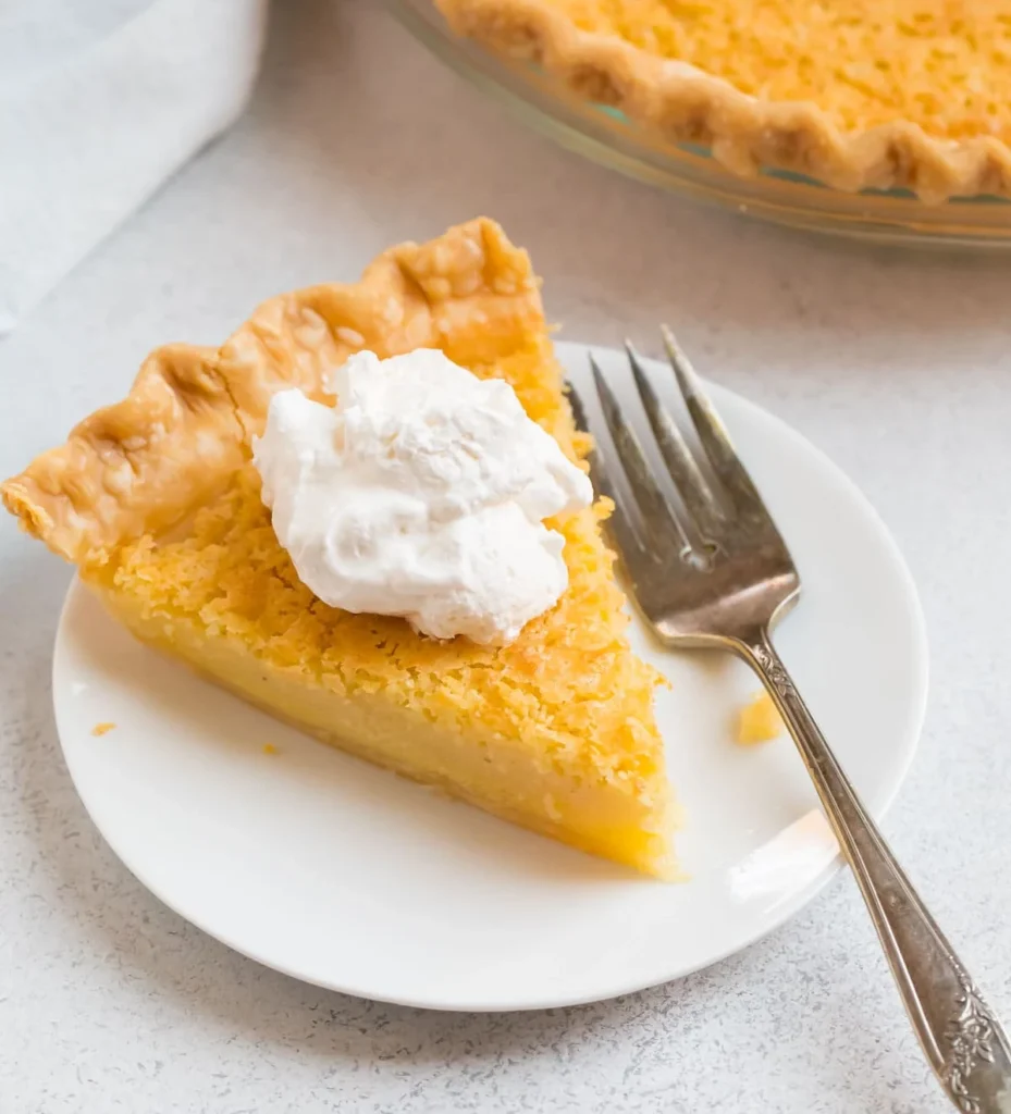 slice of Buttermilk Pie in  plate with fork