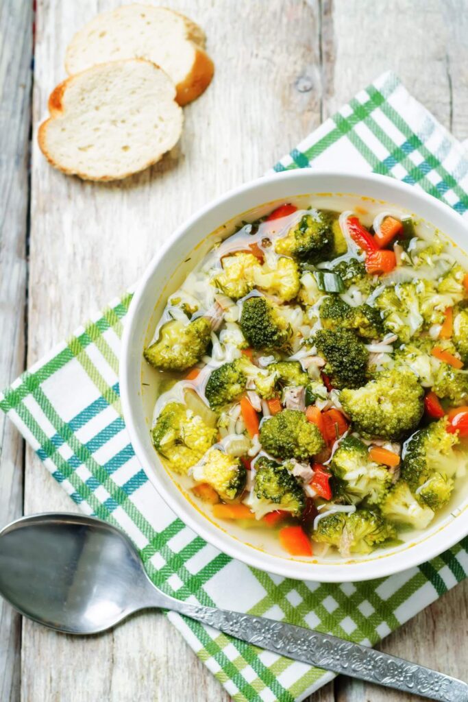 Chicken Broccoli Soup  in white bowl with spoon