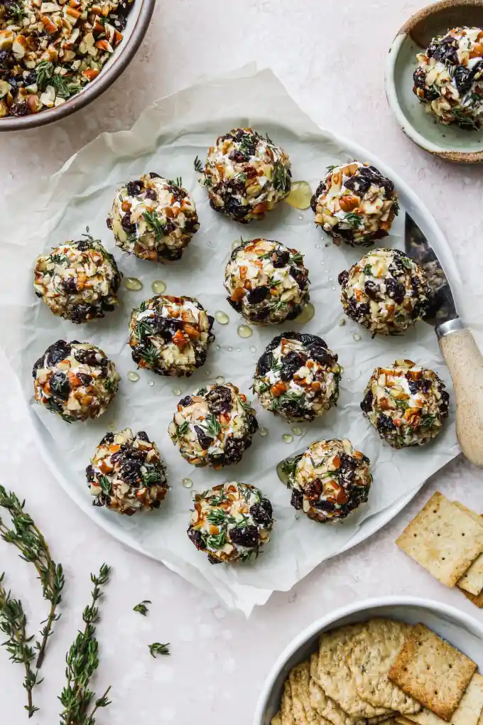 Cranberry Pecan Goat Cheese Balls in large white plate