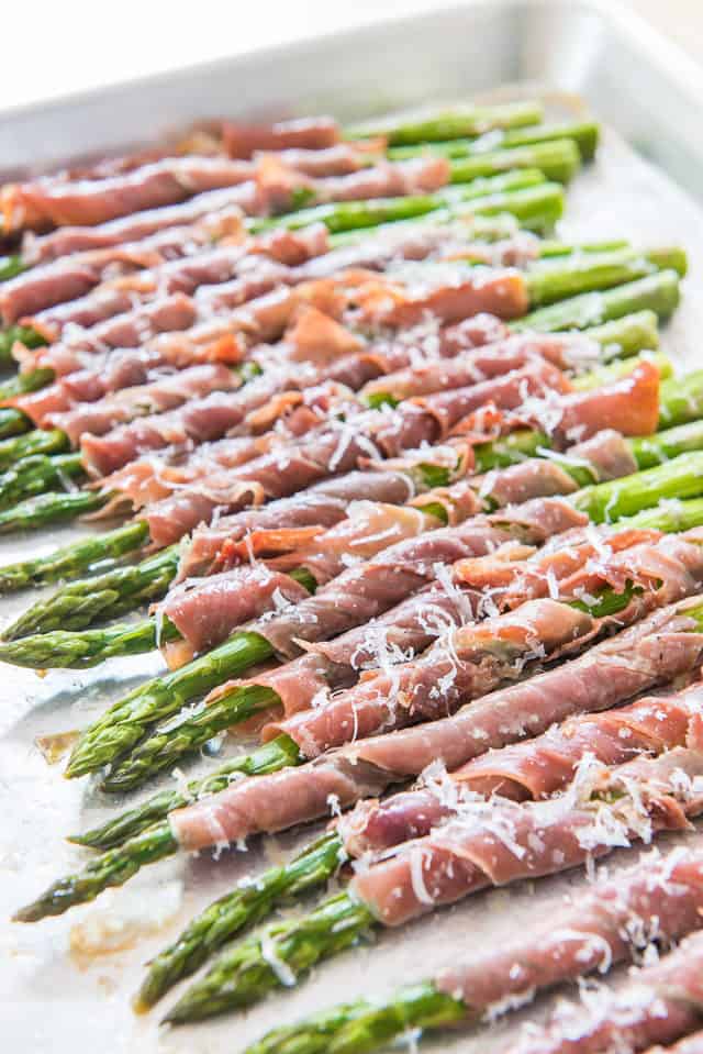 Prosciutto-Wrapped Asparagus in white tray