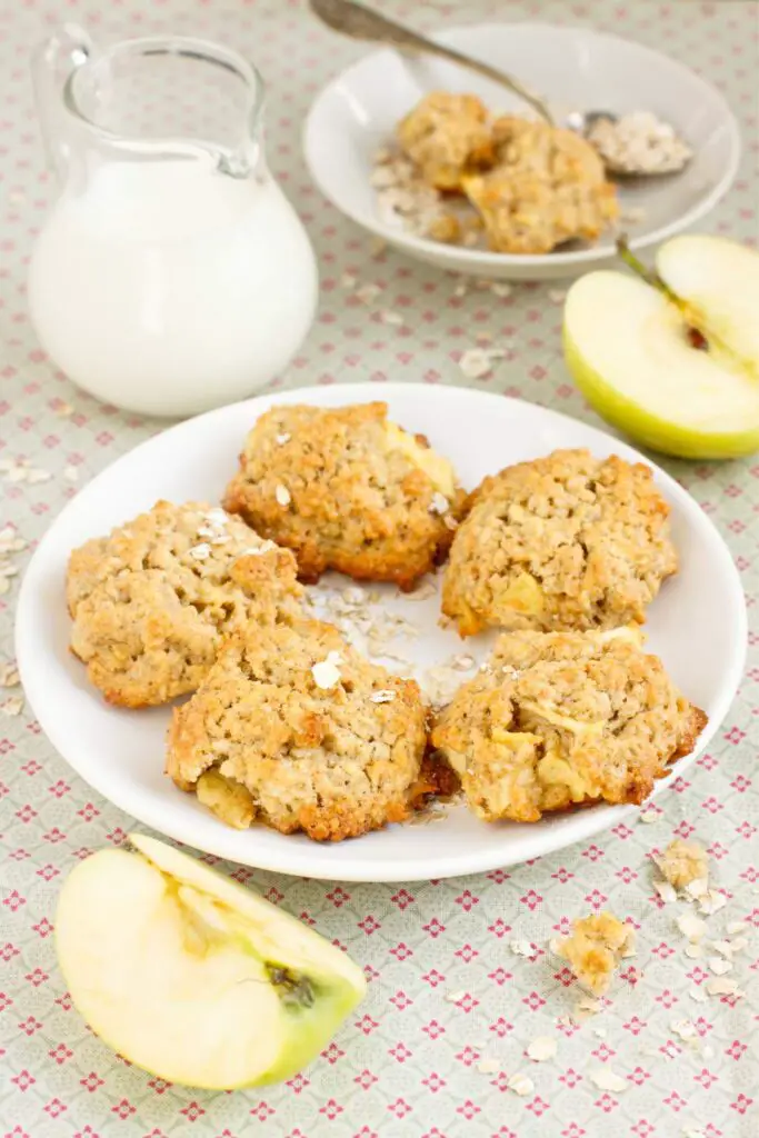 Spiced Apple Oatmeal Cookies in plate with jar of milk