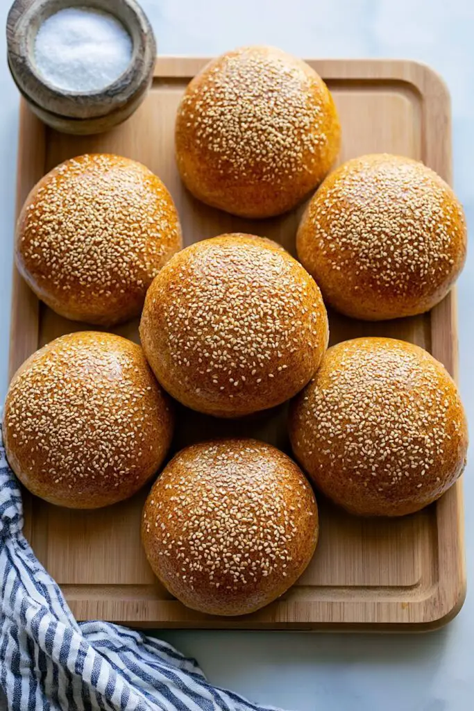 Honey Whole Wheat Hamburger Buns  putted in a wooden tray