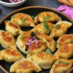 Sweet Potato Dumplings in black plate