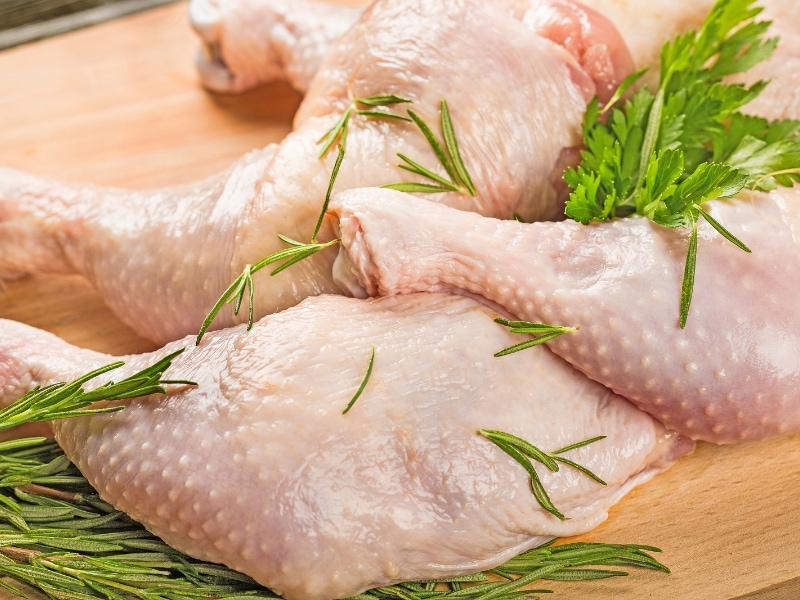 Chicken on wooden table