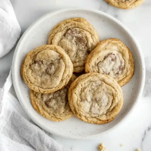 Chocolate Chipless Cookies in white plate beside white napkin is placed