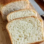 slices of cpttage bread place on wooden table