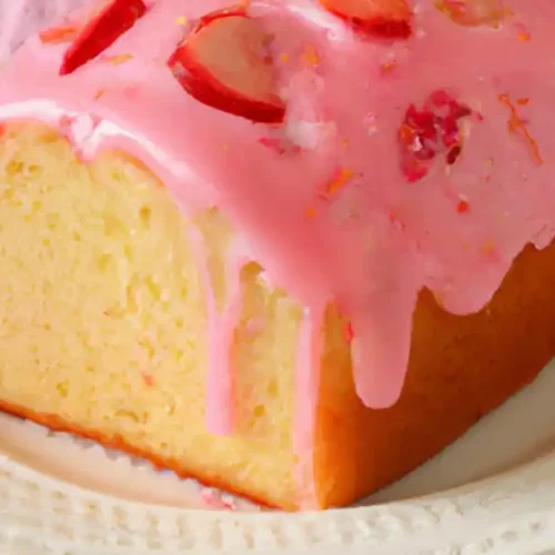 Gluten Free Strawberry Bread with pink glaze in plate