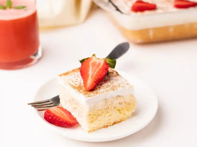 Strawberry milk cake in plate with fork