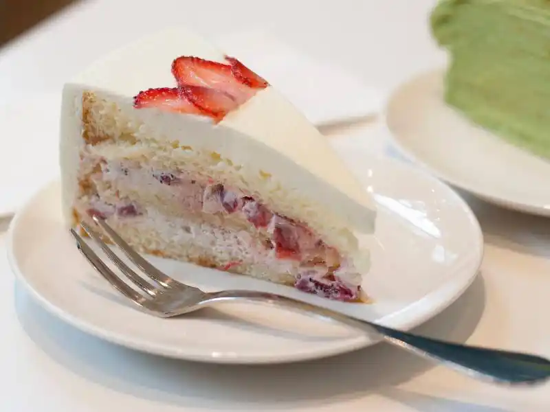 eggless strawberry shortcake in plate with fork