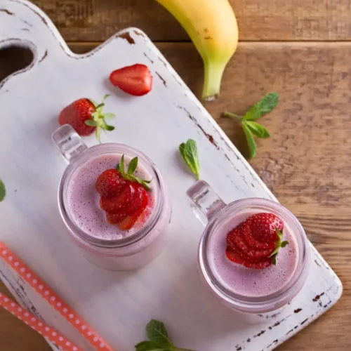 Strawberry banana milkshake in glass