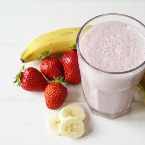 Strawberry banana milkshake in glass