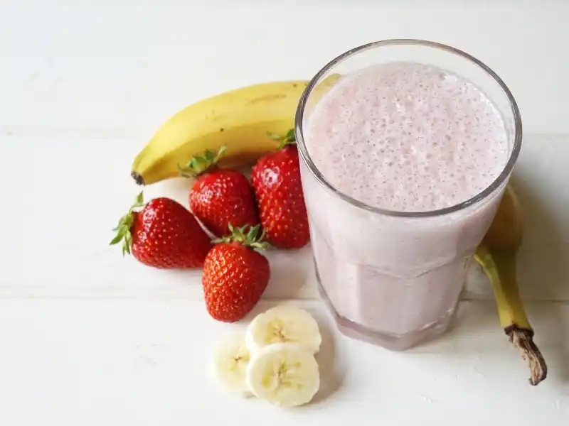 Strawberry banana milkshake in glass