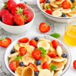 mini strawberry pancakes in bowl