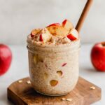 Apple Pie Overnight Oats in glass place in wooden board