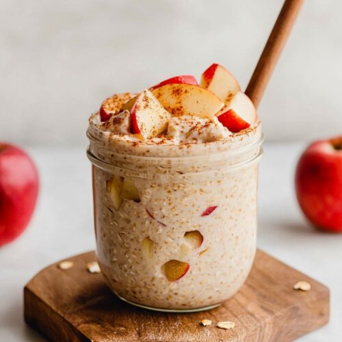 Apple Pie Overnight Oats in glass place in wooden board