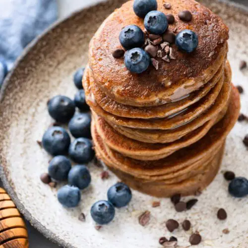 3-Ingredient Almond Flour Pancakes (No Banana) topped with blueberries