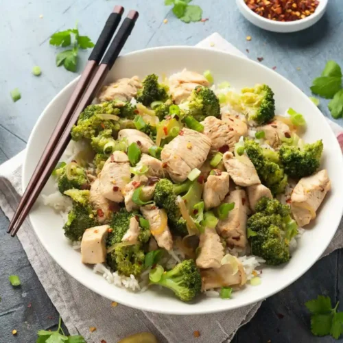 5-ingredient chicken and broccoli recipe in white plate with fork