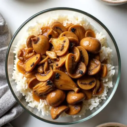 3-Ingredient Creamy Mushroom Crockpot Chicken served over rice