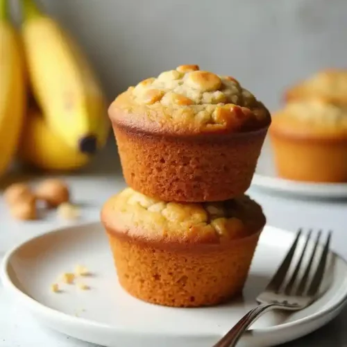 stack of banana bread muffins in white plate