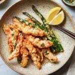 salmon tempura with lemon wedges